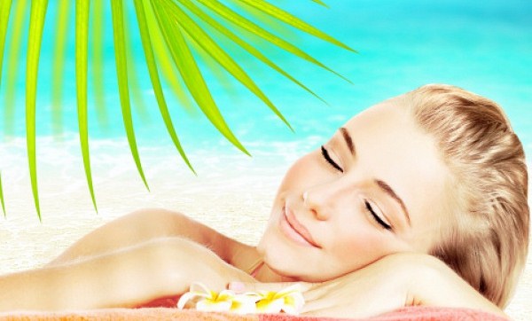 Summer facial treatments by a beautician