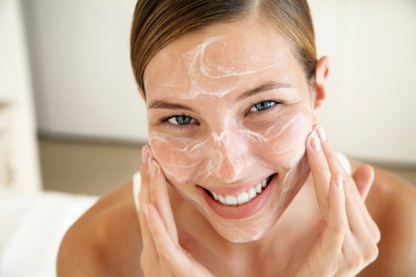 Summer facial treatments by a beautician