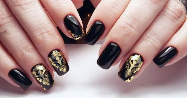 Nail design in black, with black varnish, gold, silver, rhinestones. New items and photos