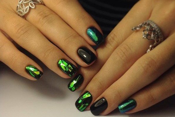 Nail design in black, with black varnish, gold, silver, rhinestones. New items and photos