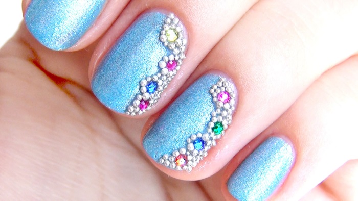 Manicure gel polish with rhinestones. Fashion trends, photos with broths, sparkles, rubbing, french, the most beautiful design