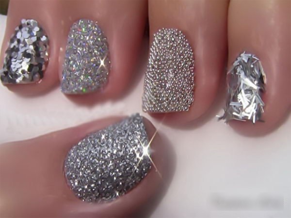 Manicure gel polish with rhinestones. Fashion trends, photos with broths, sparkles, rubbing, french, the most beautiful design