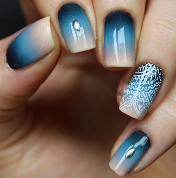 Blue jacket on the nails.Photo of new manicure with a pattern, rhinestones, sparkles, design ideas for spring, winter and summer