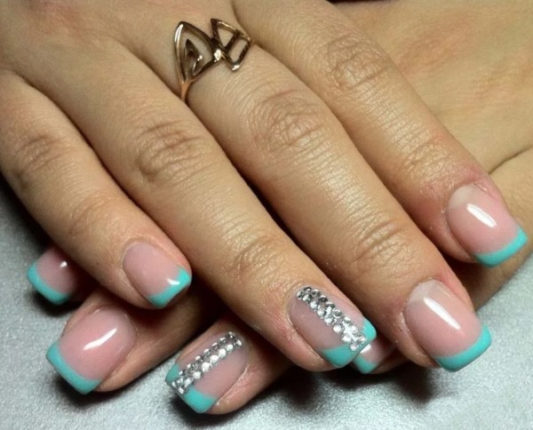 Blue jacket on the nails. Photo of new manicure with a pattern, rhinestones, sparkles, design ideas for spring, winter and summer