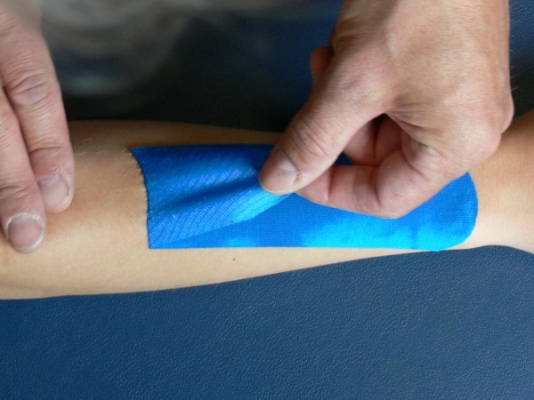 Kinesio taping. What is it in cosmetology, medicine, sports. Tapes, aesthetic, lymphatic drainage from wrinkles, nasolabial folds