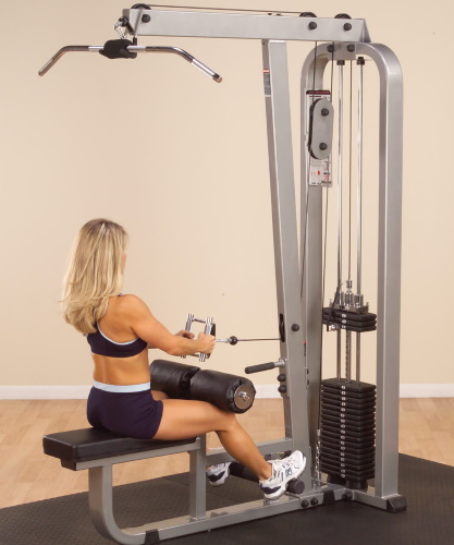 Exercise machine vertical pull. Technique for sitting, on the back, behind the head, with a narrow grip for women