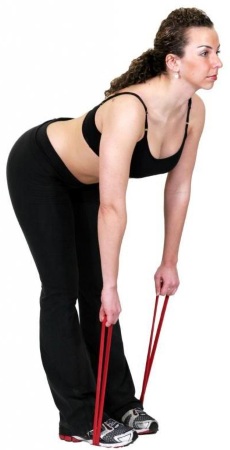 Exercise with an elastic band for fitness. Exercises for the whole body, legs, buttocks, for the press of women