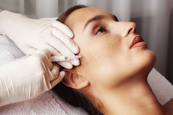 Facial treatments in the salon with a beautician, at home before the wedding, after peeling, sea, cleaning